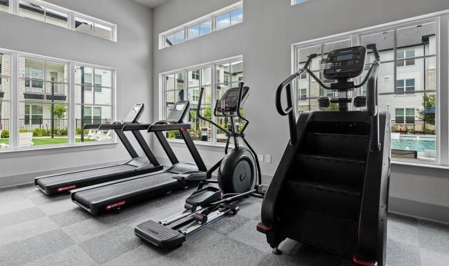 cardio equipment in bright gym